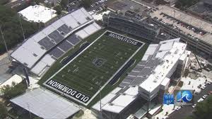 Old Dominion football team takes the field at S.B. Ballard Stadium for a Thursday night game in 2026