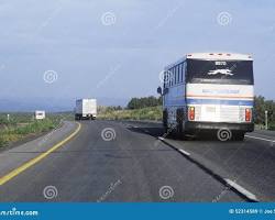 Image of Greyhound bus traveling on a highway