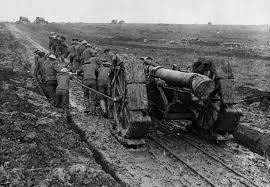 WWI - Soldiers struggle to pull a huge piece of artillery ...