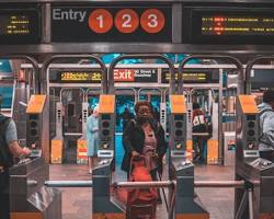 Image of person using a phone app to navigate the NYC subway