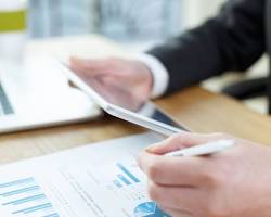 Image of person budgeting their finances on a laptop