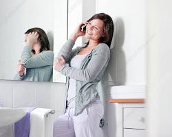 Image of Talking on the phone in the bathroom