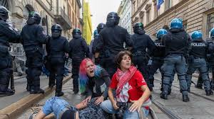 Rioters loot stores, set fires in central Milan during cost-of-living protest - AP News