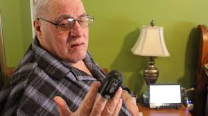 John Mealey uses his oximeter every day to measure the oxygen levels in his ... - 060114_JM_telehomecare3