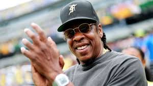 Jay Z performing at a stadium during his Super Bowl halftime show announcement
