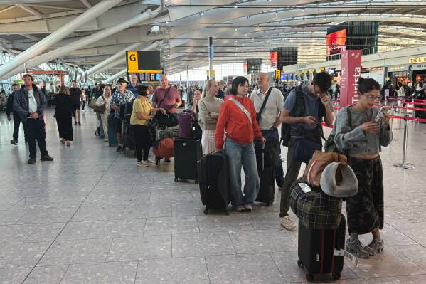 UK air traffic failure cancels more than 2,000 flights; airlines scramble to clear backlog as passengers recount 'pandemonium' at airports