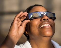 Image of person wearing eclipse glasses