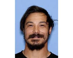 A dad accused of killing his 3 young daughters is on the run. Here's what to know