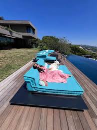 Salma Hayek Is Regal in a Bubblegum Pink Liquid Gown While Lounging Poolside With Her Dogs