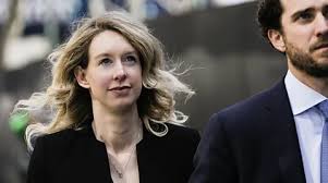 'As famous and defiant as ever': Why Elizabeth Holmes remains the US's most fascinating fraudster