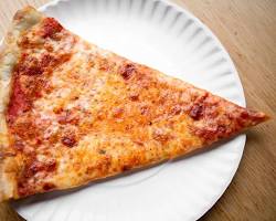 Image of person enjoying a slice of New Yorkstyle pizza