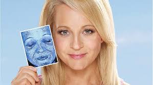 Shocked ... Carrie Bickmore holding her UV screen image. Today marks the launch of the Sunsense UV Photo Bus in Sydney. Offering free skin screenings across ... - art-Carrie-Bickmore---SunSense-Ambassador-with-her-UV-image-2a-620x349