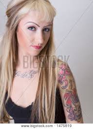 Tattoo Biker Chick With Coy Look. Create a lightbox - 1475819