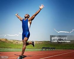 Image of runner crossing the finish line