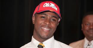Mark Dodson smiles as he places his Ole Miss cap on his head Monday morning. Photo by Paul Gandy Rebels247. 2013 Whitehaven running back Mark Dodson commits ... - 6_500771