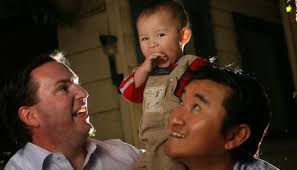 Rodney Cruise and his partner, Jeff Chiang, with their first child, Ethan, conceived by a surrogate in the United States. Photo: Justin Mcmanus - GAY_COUPLE_wideweb__470x269,0