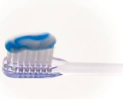 Image of Softbristled toothbrush and fluoride toothpaste