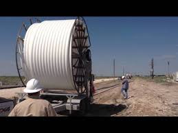 Polyflow Self Loading Trailer Unspooling - YouTube