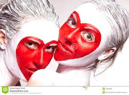 Painted faces delivering red heart pattern - painted-faces-delivering-red-heart-pattern-18093068