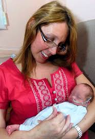 Catherine Swallow cradles her tiny baby son Joshua. Catherine gave birth to her son Joshua - whose middle name is Miguel after the Spanish doctor who helped ... - article-1189470-052168B4000005DC-61_468x684