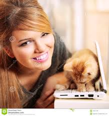 Your download plan was renewed. Congratulations and thank you for your business. Read more | Payment Profiles &middot; Girl smiling and cat kitten on laptop - girl-smiling-cat-kitten-laptop-12927946