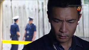 Tay Ping Hui looking intensely at yellow police tape. - 6a00d83451b52369e201543321a3e2970c-450wi