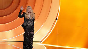 A smiling Cher laughs at her Grammys flubs in a good-natured, chaotic appearance