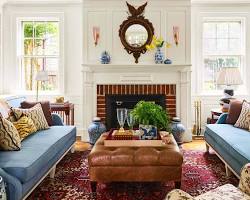 Image of beautifully designed living room with comfortable seating, a stylish rug, and interesting artwork