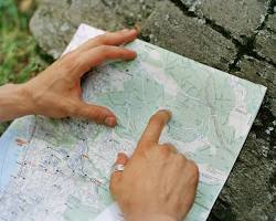 Image of person pointing to a map