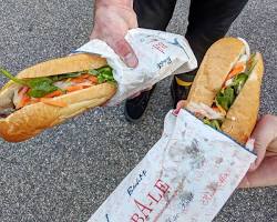 variety of trendy sandwiches, such as a Cubano sandwich, a bánh mì sandwich, and a grilled cheese sandwich with kimchi