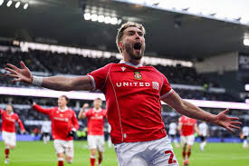 Wrexham's Unprecedented Climb: Can the Red Dragons Reach the Premier League?