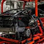 Tesla Reports Rare Quarterly Profit,