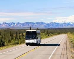 Image of shuttle bus traveling on a highway