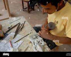 Image of Artisans crafting leather goods in a Cambodian workshop