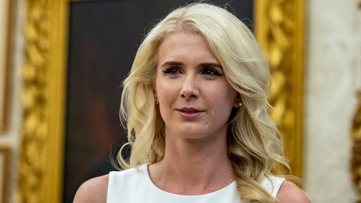 Natalie Harp's brother claims she has an 'unhealthy obsession' with Trump amid intense media scrutiny; Harp's mobile office travels with Trump.