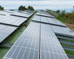 Image of solar panels powering a blockchain mining facility