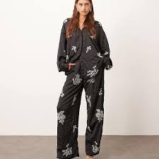 ARRANGE crinkle satin floral embellished pants in black ...