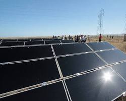 Image of solar panel array reflecting sunlight
