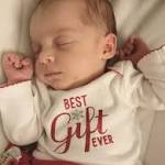 woman delivers baby from embryo