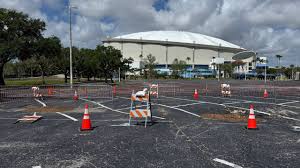 Small depression in Tropicana Field parking lot reported by Bay News 9