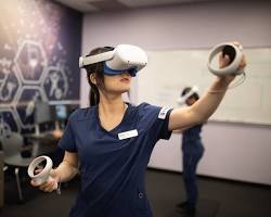 Image of student wearing a VR headset and exploring a virtual world