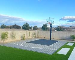 Image of outdoor basketball court with concrete flooring