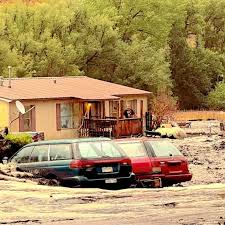 Flash flooding sends black water and debris through Colorado wildfire burn scar