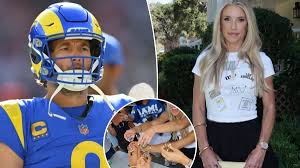 Kelly Stafford celebrating before a Los Angeles Rams game