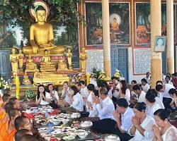Cambodians making offerings at a temple during the Pchum Ben festival.