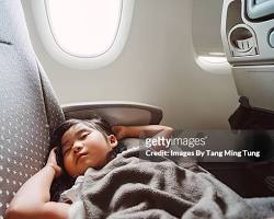 person sleeping soundly on an airplane