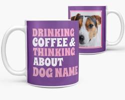 person drinking coffee from a mug with a pet photoの画像