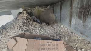 Man accused of digging hole under UTA bridge faces new charges