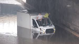 New Yorkers, after days of heavy smoke and torrid temperatures, are met with thunderstorms and flash flooding