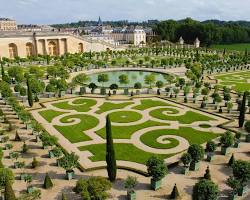 Manicured lawns and vibrant flowers inside the Royal Palace gardens.